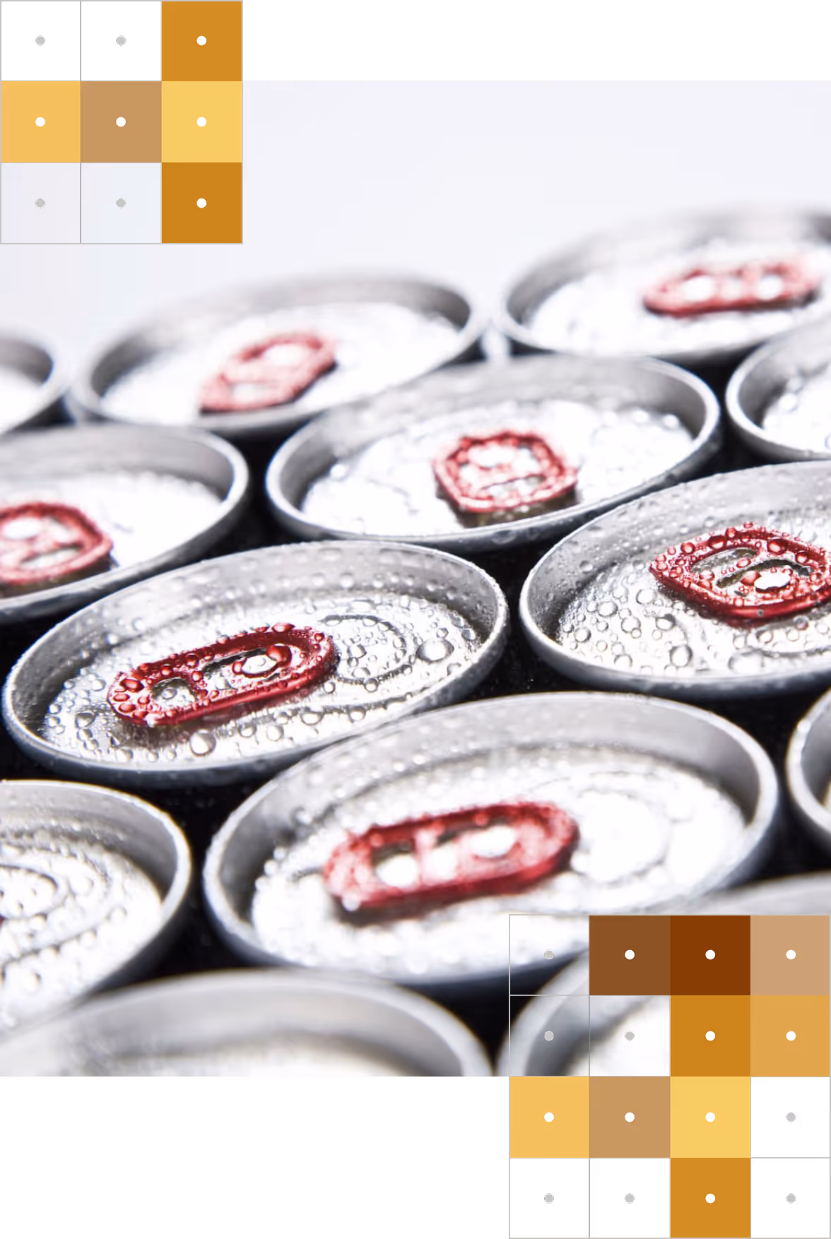 Close-up of aluminum can tops with red pull tabs covered in water droplets.