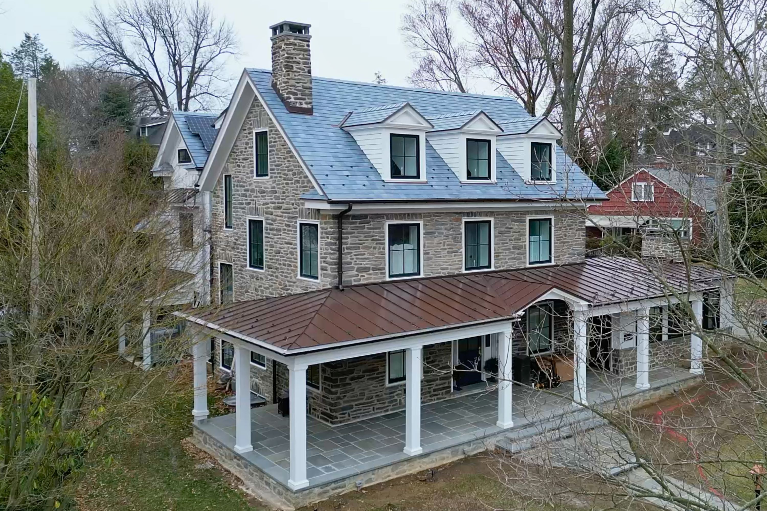 A full gut renovation retaining three original stone walls, paired with a 2,500 sf addition. New windows, roofing, solar integration, and high-performance assemblies redefine the home’s structure.