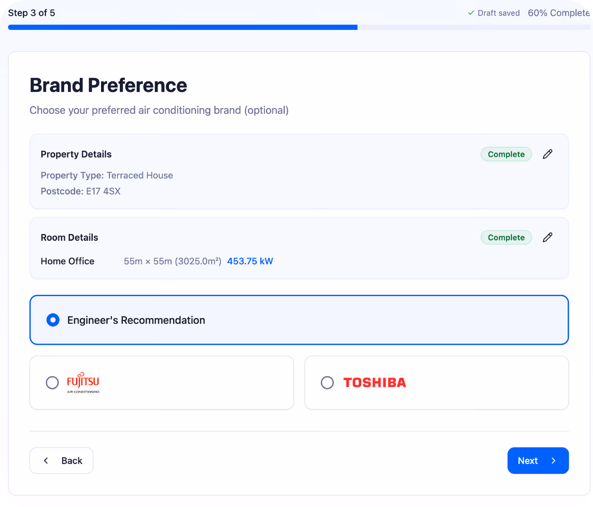 Close-up of hands typing on a laptop keyboard with a blurred document open on the screen.