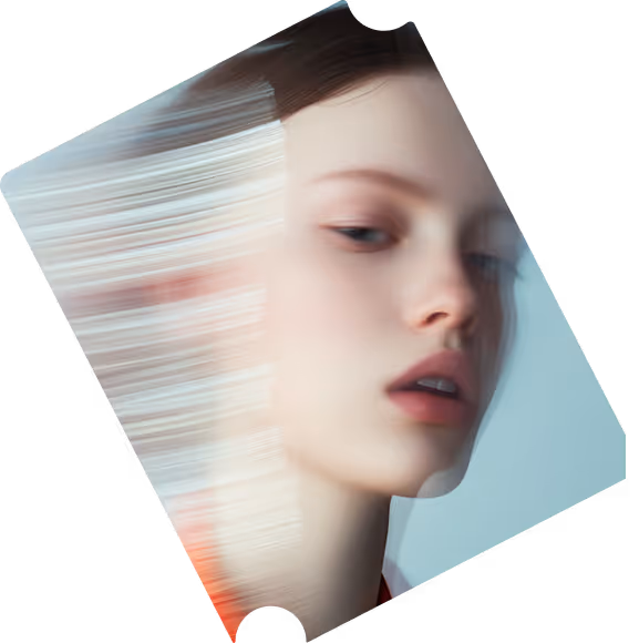Blurred portrait of a young woman with fair skin and light hair, with a motion effect creating streaks on the left side of her face.