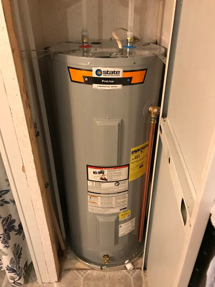 Gray State Water Heaters ProLine commercial grade water heater installed in a small utility closet.