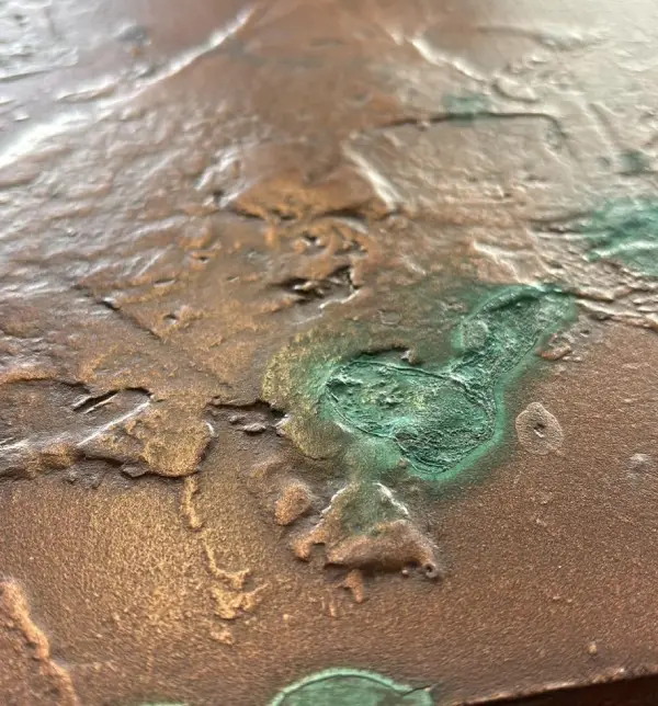 Pitted copper polished concrete sample by RockVine
