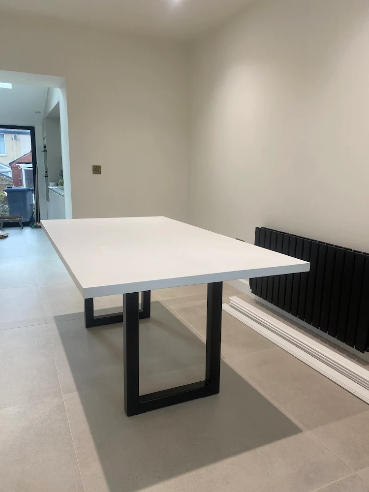 Slimline white polished concrete dining table with textured finish