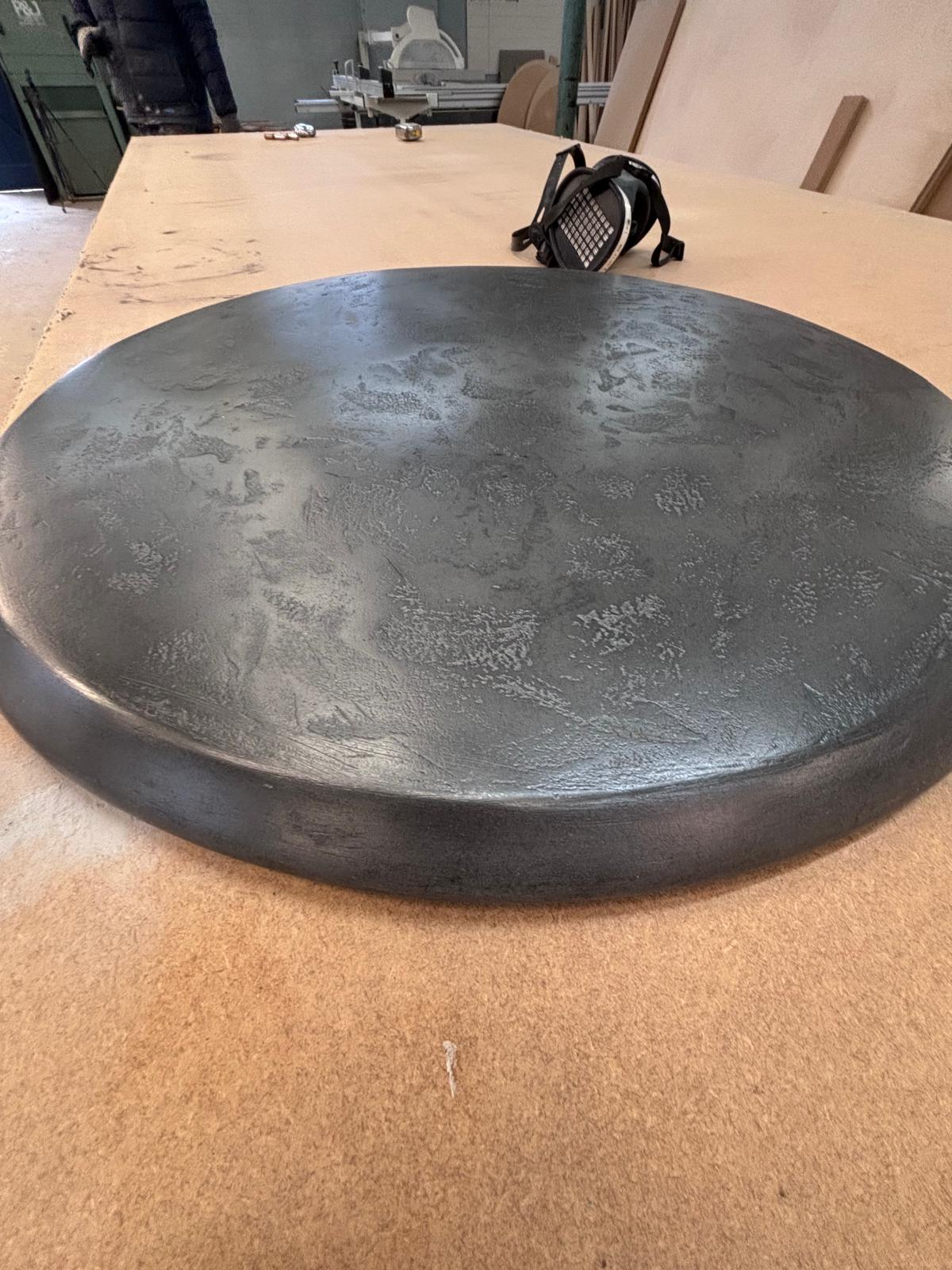 A black liquid metal and graphite table top by RockVine