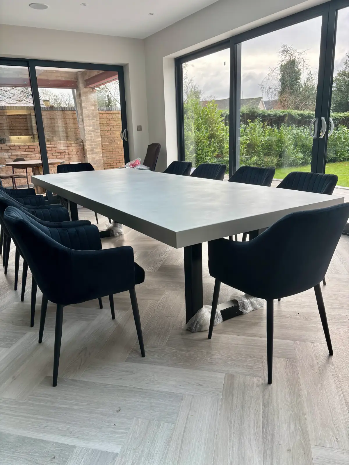 Premium light grey polished concrete dining table with 75mm edge profile