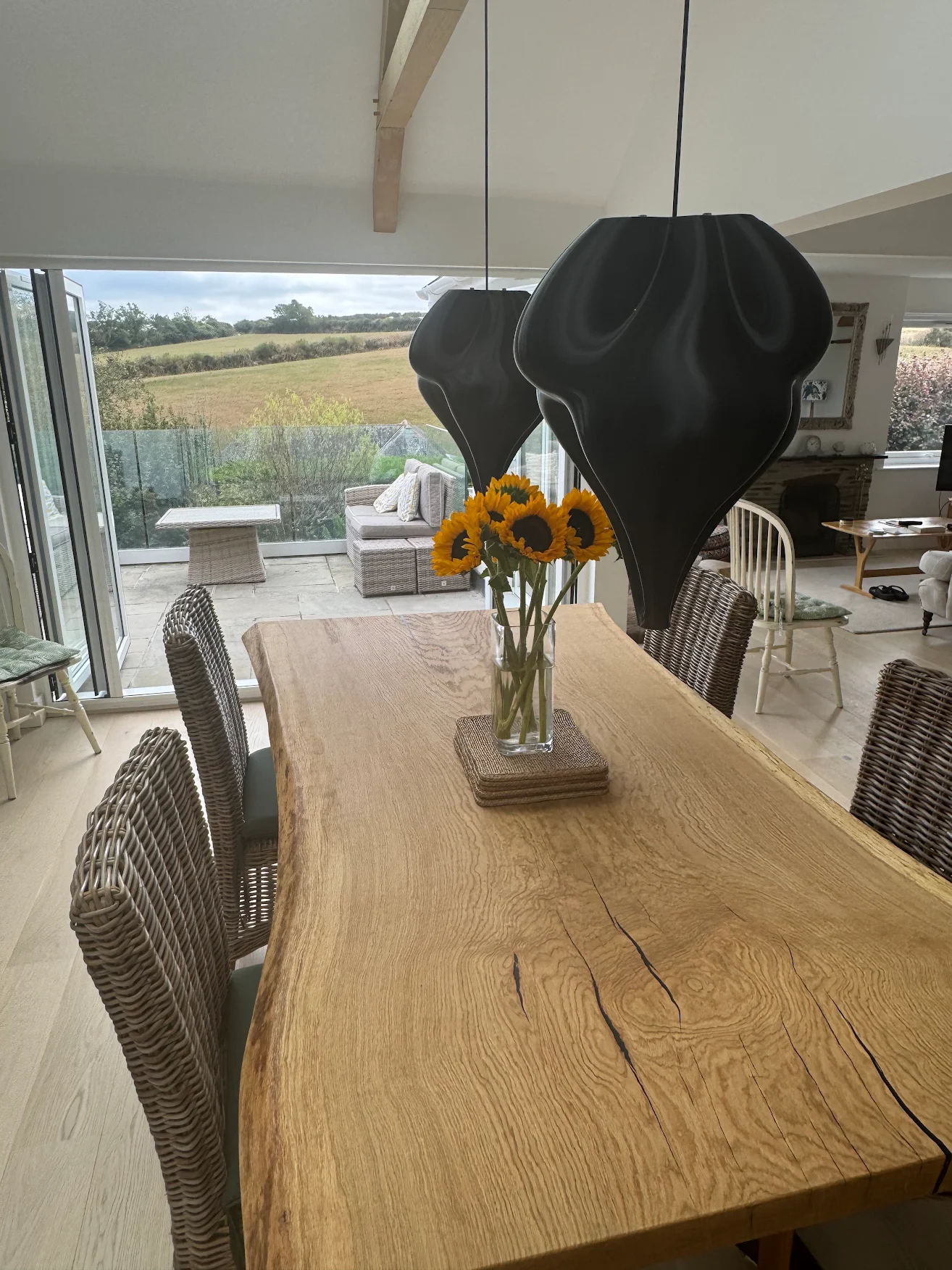 Solid live edge oak dining table with resin infills, handmade by RockVine
