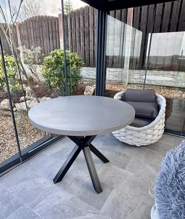 Round polished concrete dining table made by RockVine in Stockport