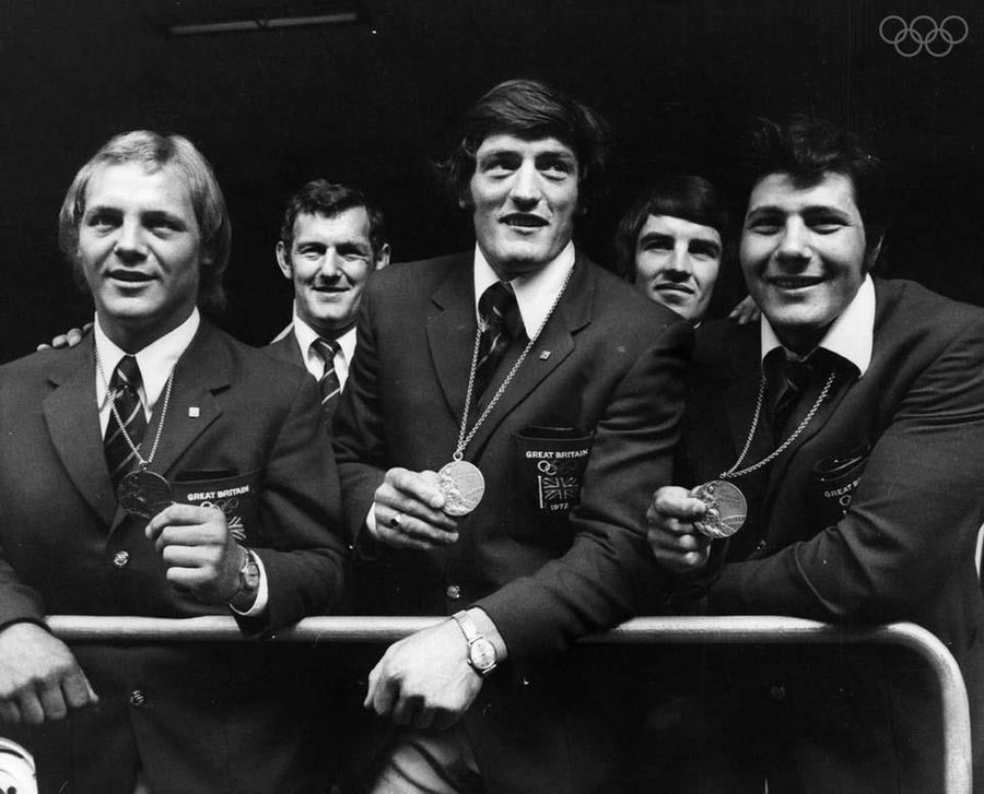 Donning the national ceremonial uniform, Britain's judo team celebrates their earned medals at the 1972 Munich Olympics. Left to right: Brian Jacks, Dave Starbrook and Angelo Parisi.