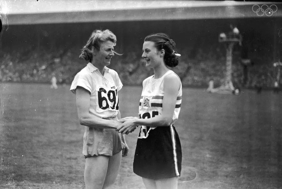 Silver medallist Maureen Gardner of the UK congratulates gold medalist, Fanny Blankers-Koen of the Netherlands during the 1948 London games.