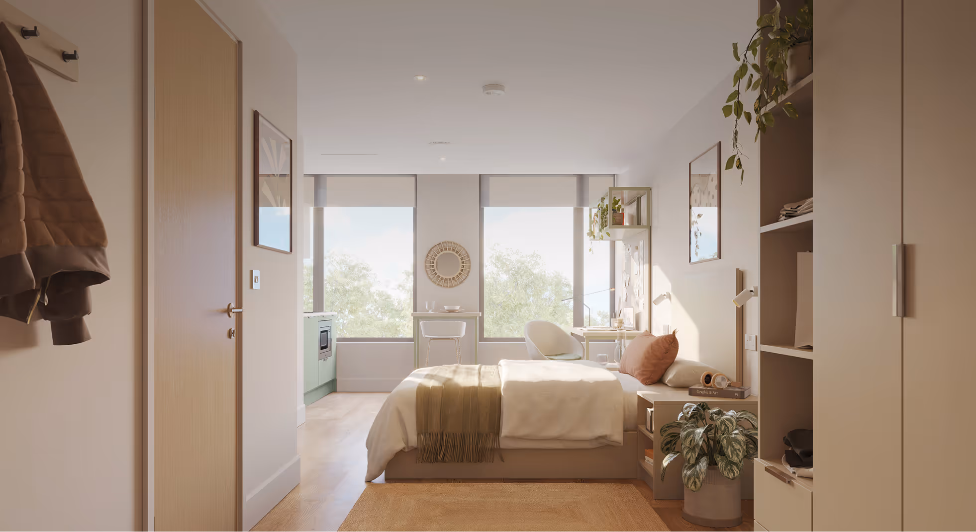 Sunlit modern bedroom with a neatly made bed, green throw, large windows, workspace with chair, and indoor plants.