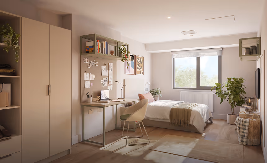Modern bedroom with a bed, desk, chair, wardrobe, and plants, illuminated by natural light from a window.