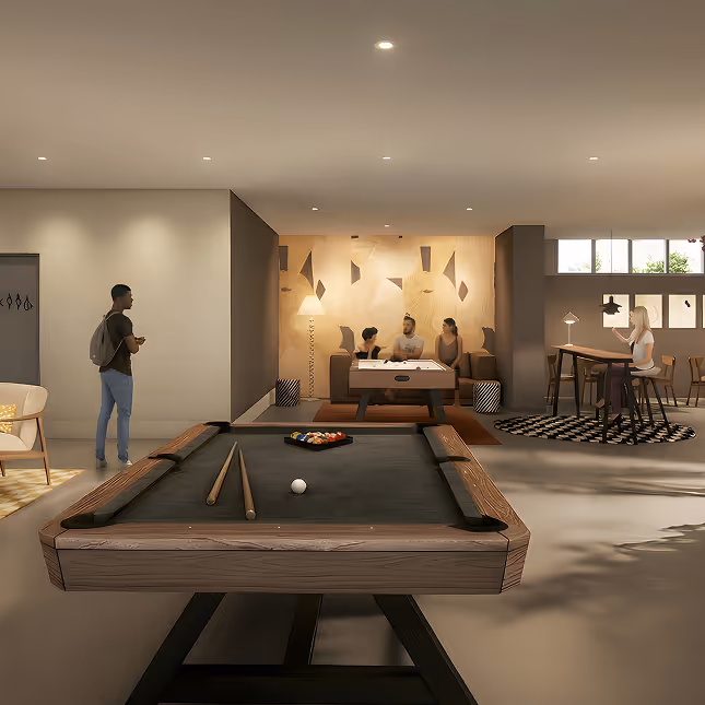 Modern game lounge with a pool table in foreground, three people sitting on a sofa behind a foosball table, and a person standing near the entrance.