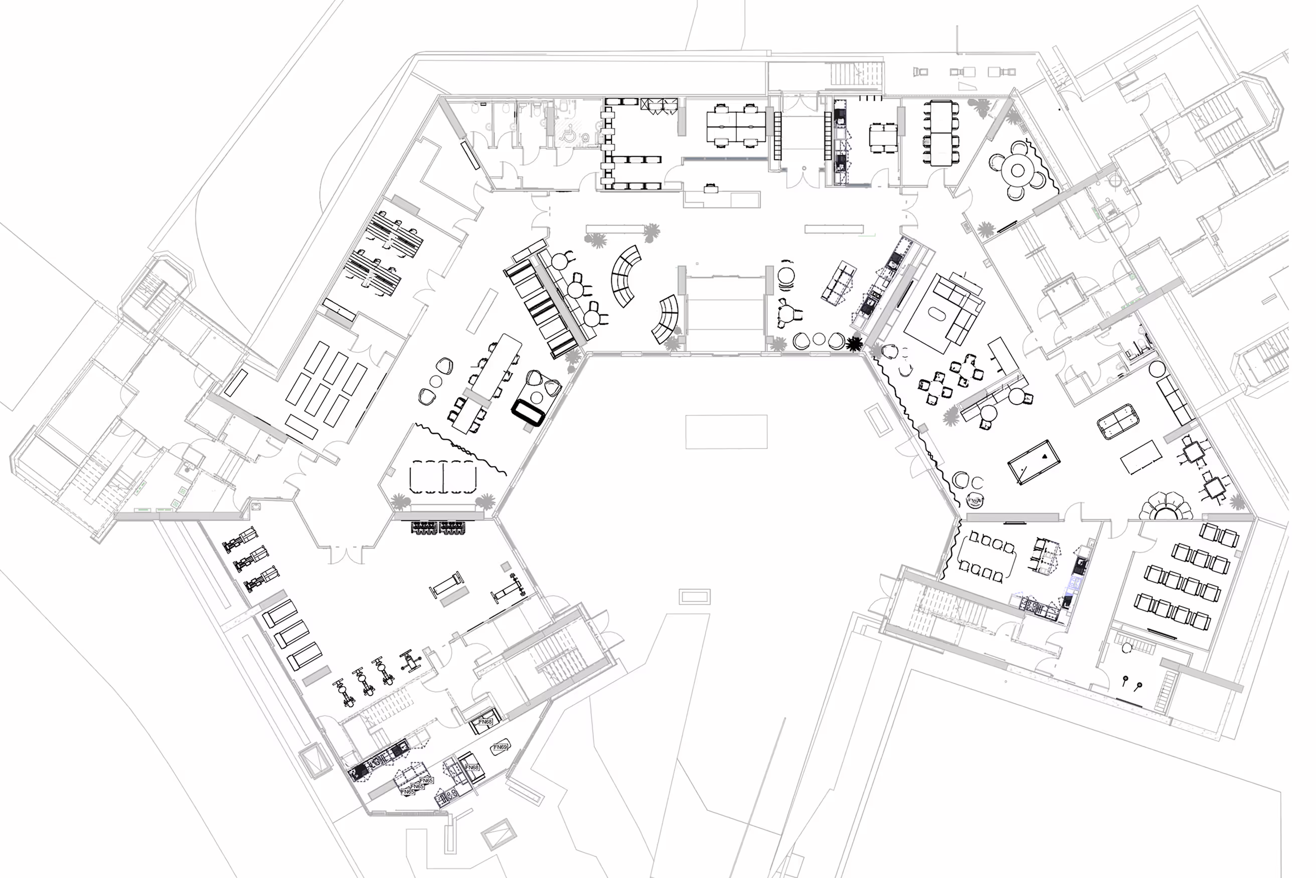 Architectural floor plan showing a multi-sectioned building with various rooms including office spaces, conference rooms, common seating areas, a gym, and recreational spaces.
