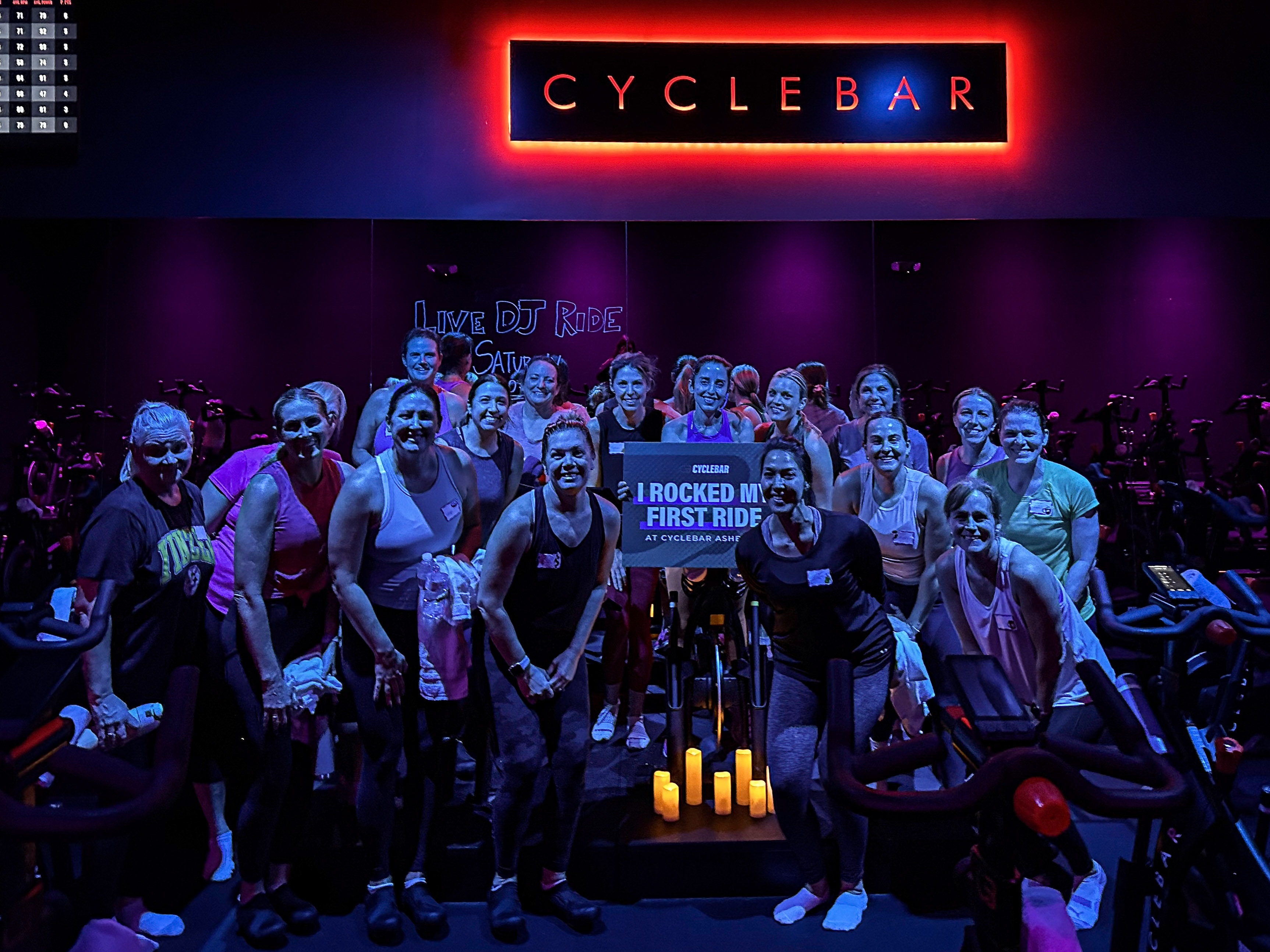 Riders together in a CycleBar Ashburn group ride for the National Charity League