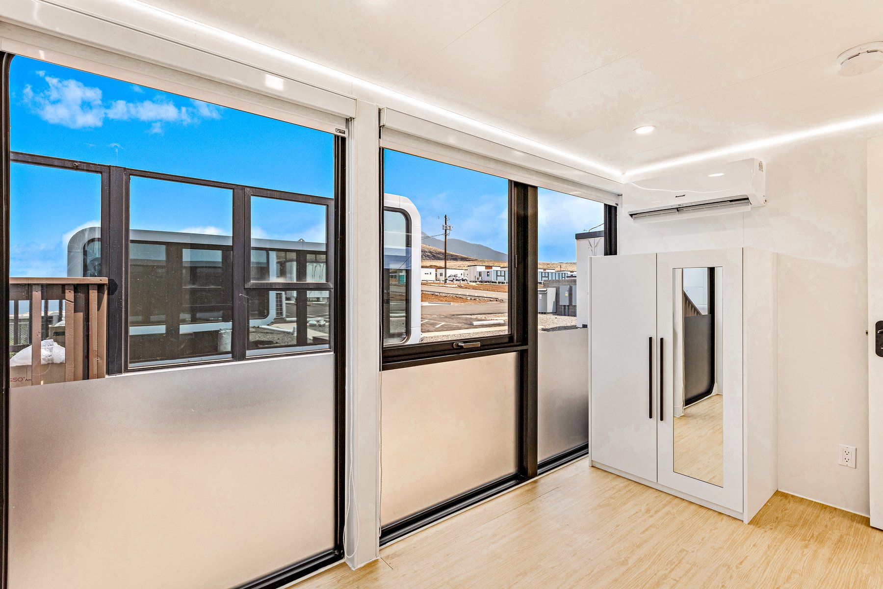 Bedroom with sliding glass & wardrobe