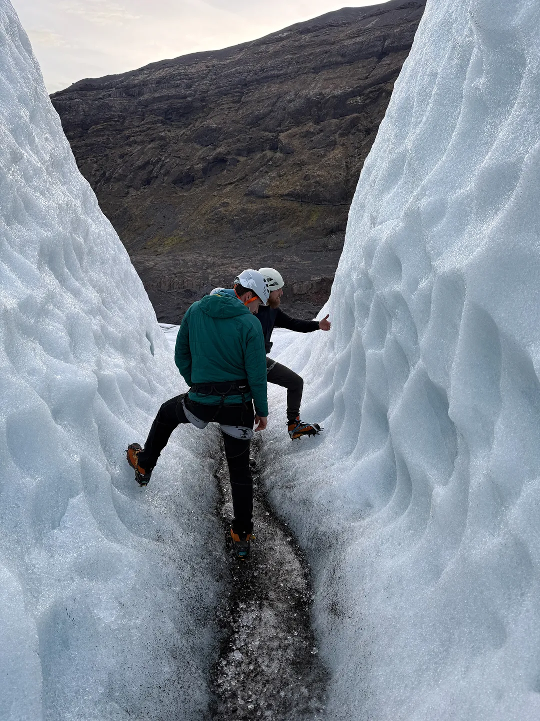 Hrafnar Guides glacier guide explaining safety procedures and equipment use before Sólheimajökull glacier hike