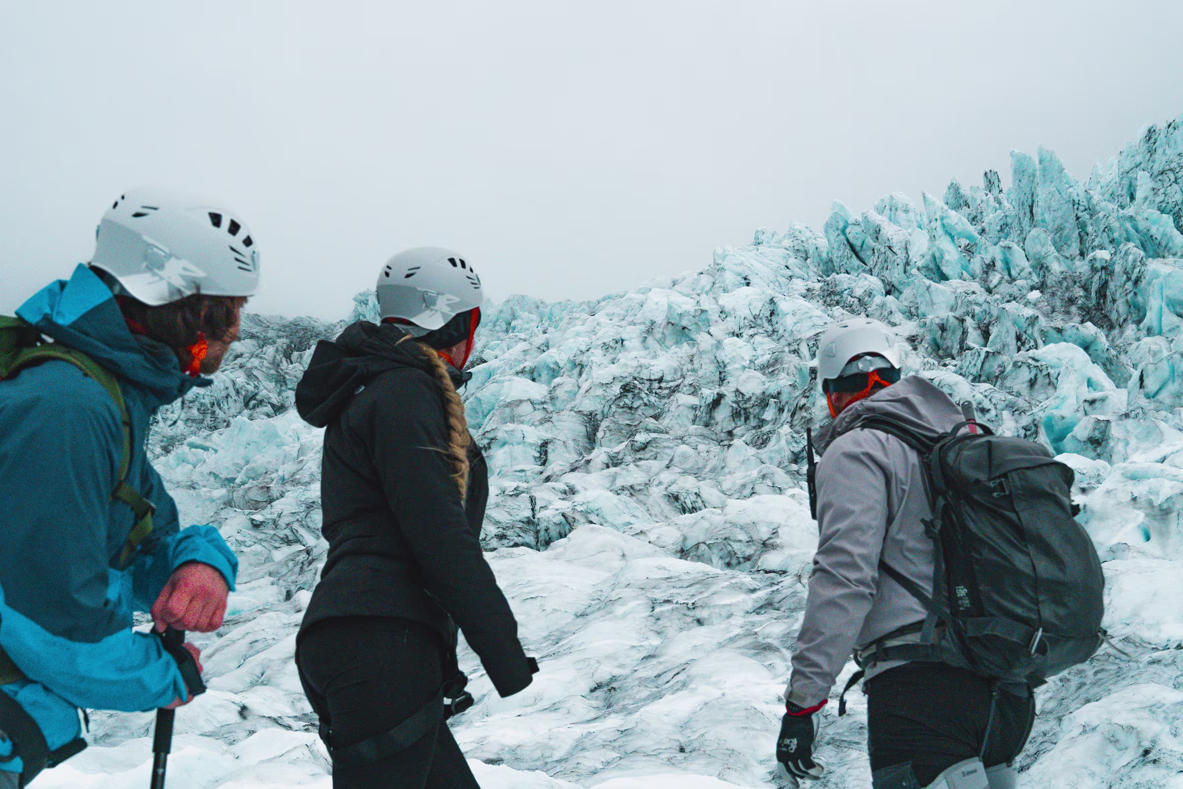 Small guided group hiking on Sólheimajökull glacier ice