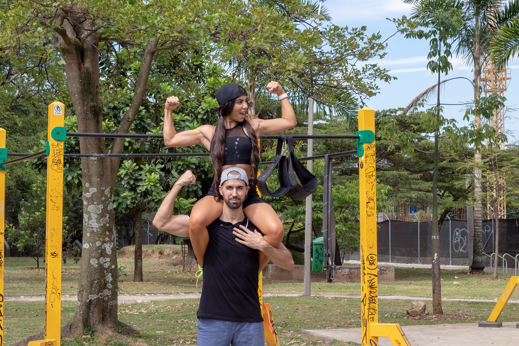 Personal trainers working with a client, representative of fitness studios in Springdale, Arkansas