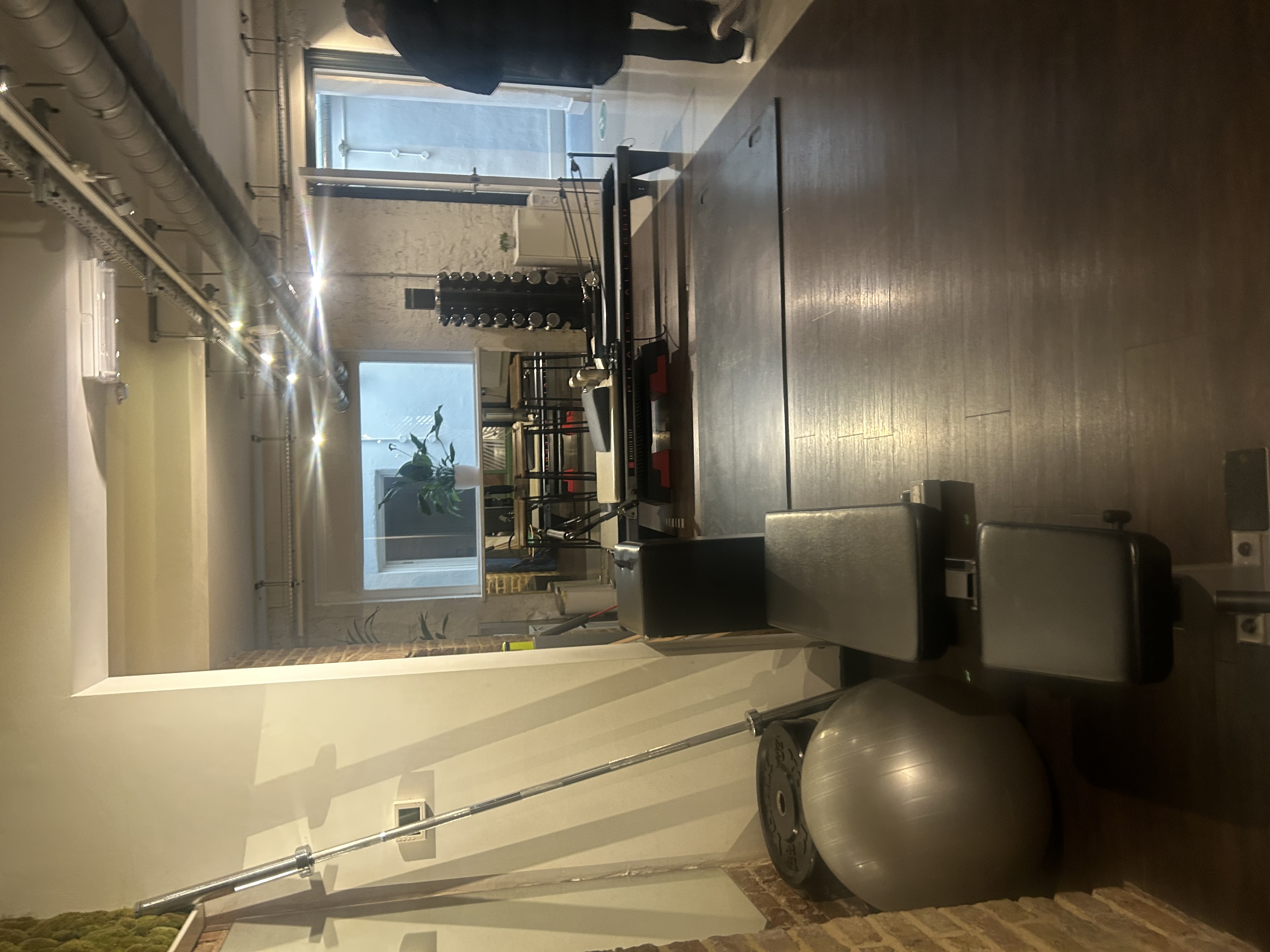 Pilates reformer equipment in a studio, representative of Club Pilates in Bentonville, Arkansas
