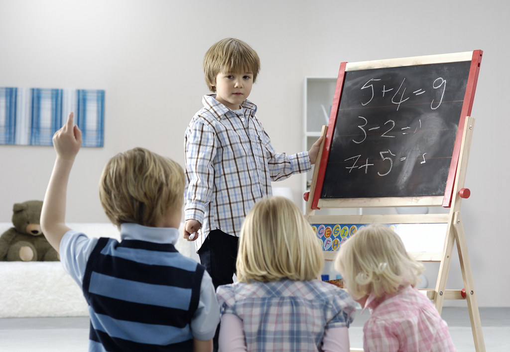 Young children in a classroom setting, representative of early childhood academies in Bentonville, Arkansas