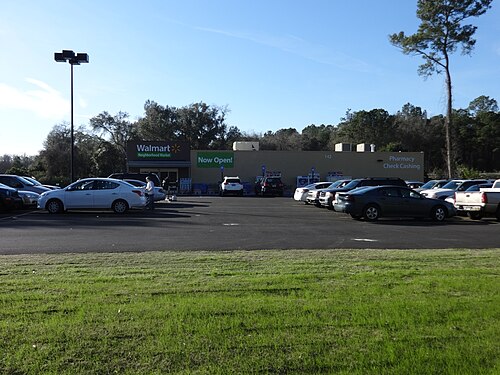 A Walmart Neighborhood Market storefront, representative of the Fayetteville, Arkansas location