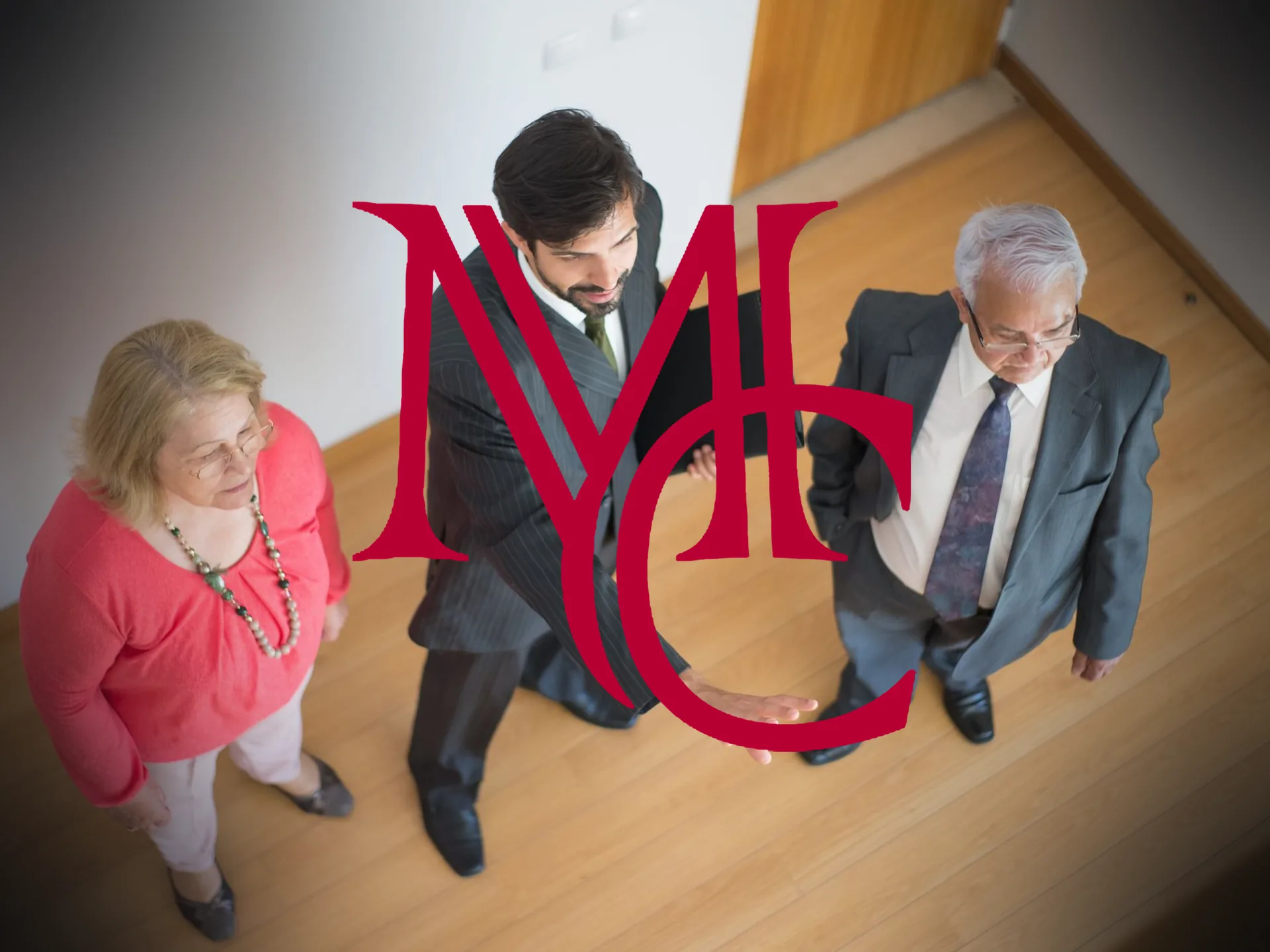Real estate agent showing a home interior to an older couple — MCG