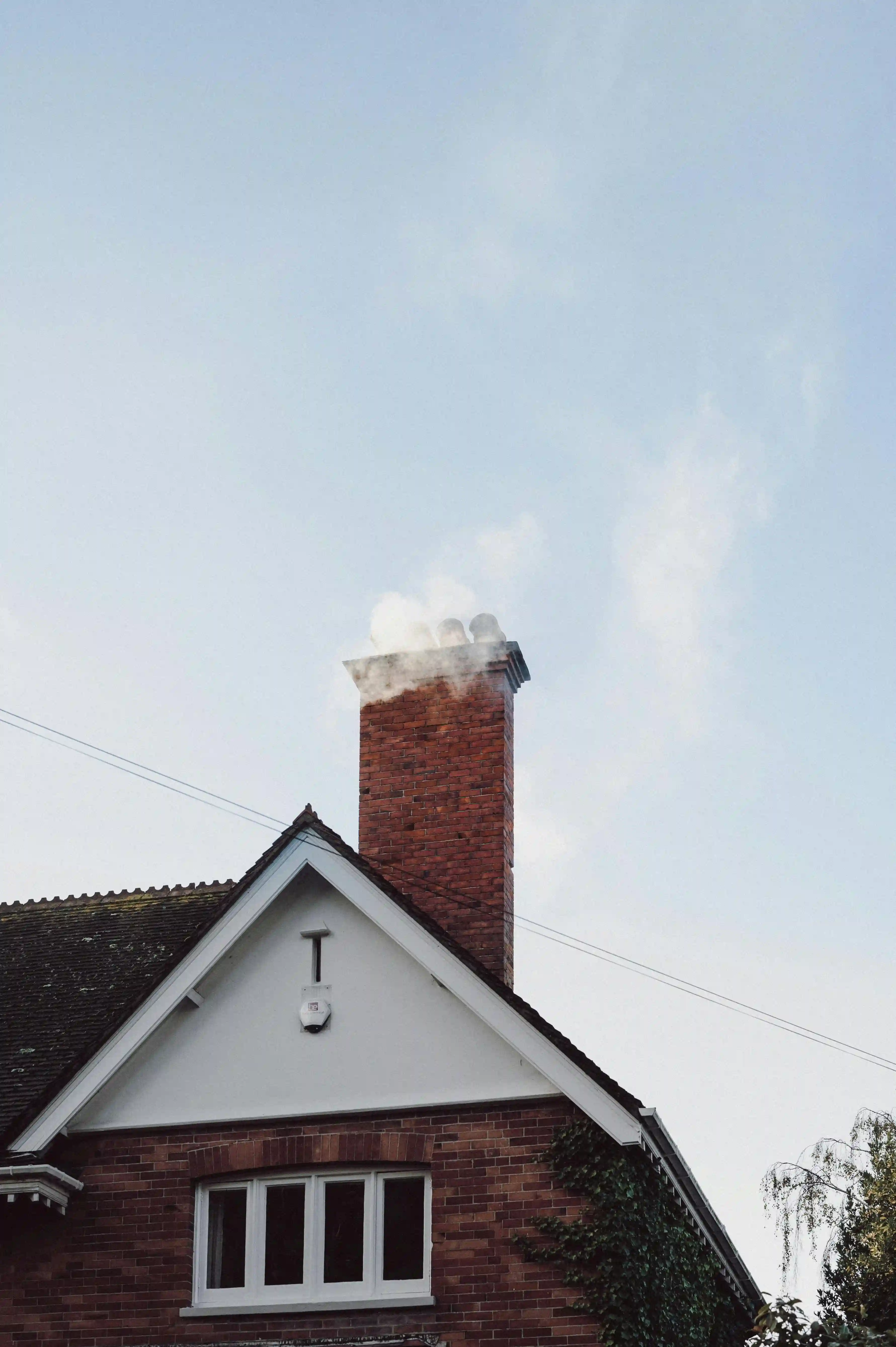 Close up of chimney coming out of roof top