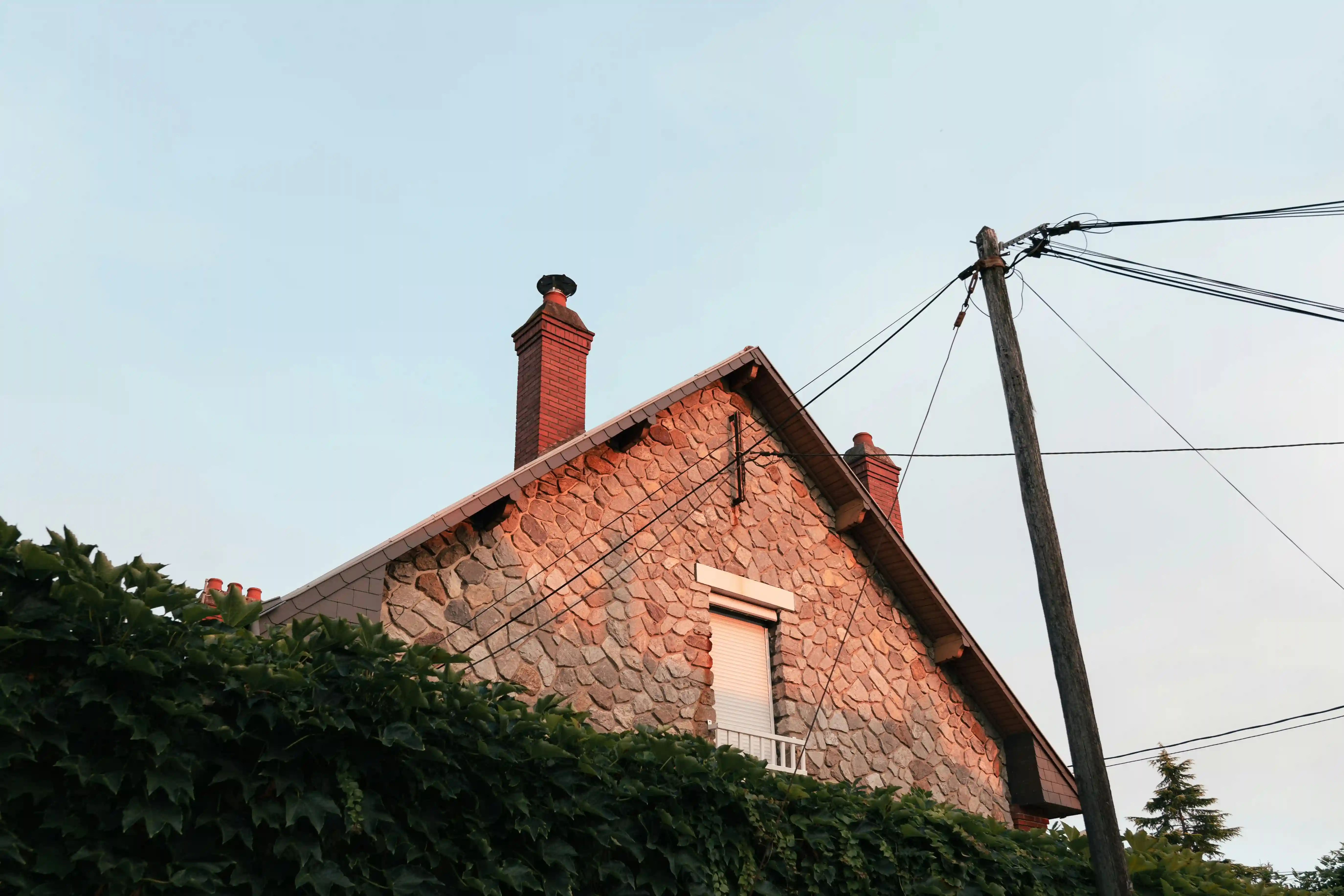Close up of chimney coming out of roof top