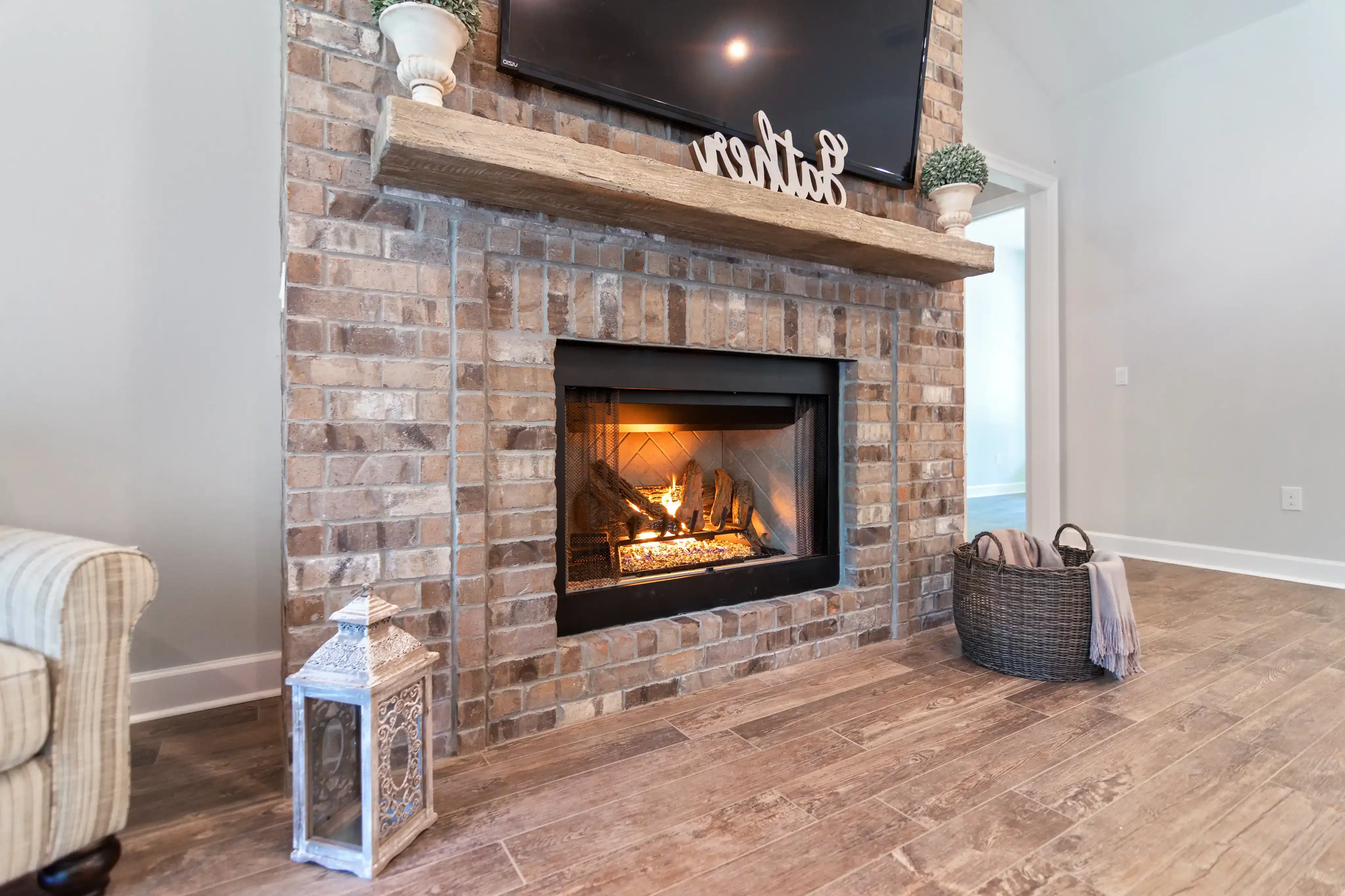 Close up of lit fireplace in living room