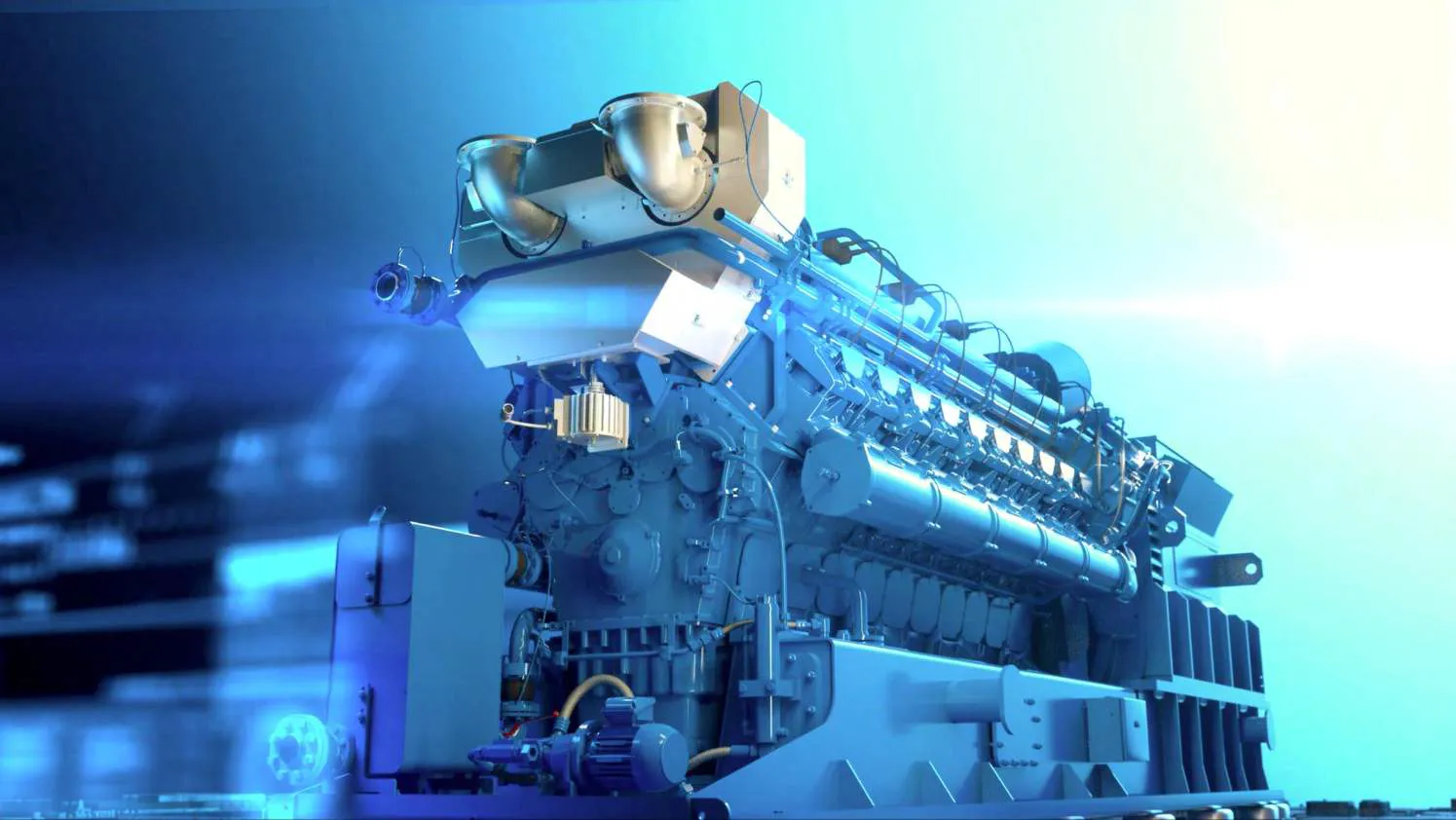 Large industrial engine or generator unit with complex machinery in blue lighting.
