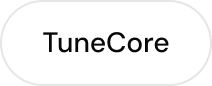 White pill-shaped button with the text TuneCore in black.