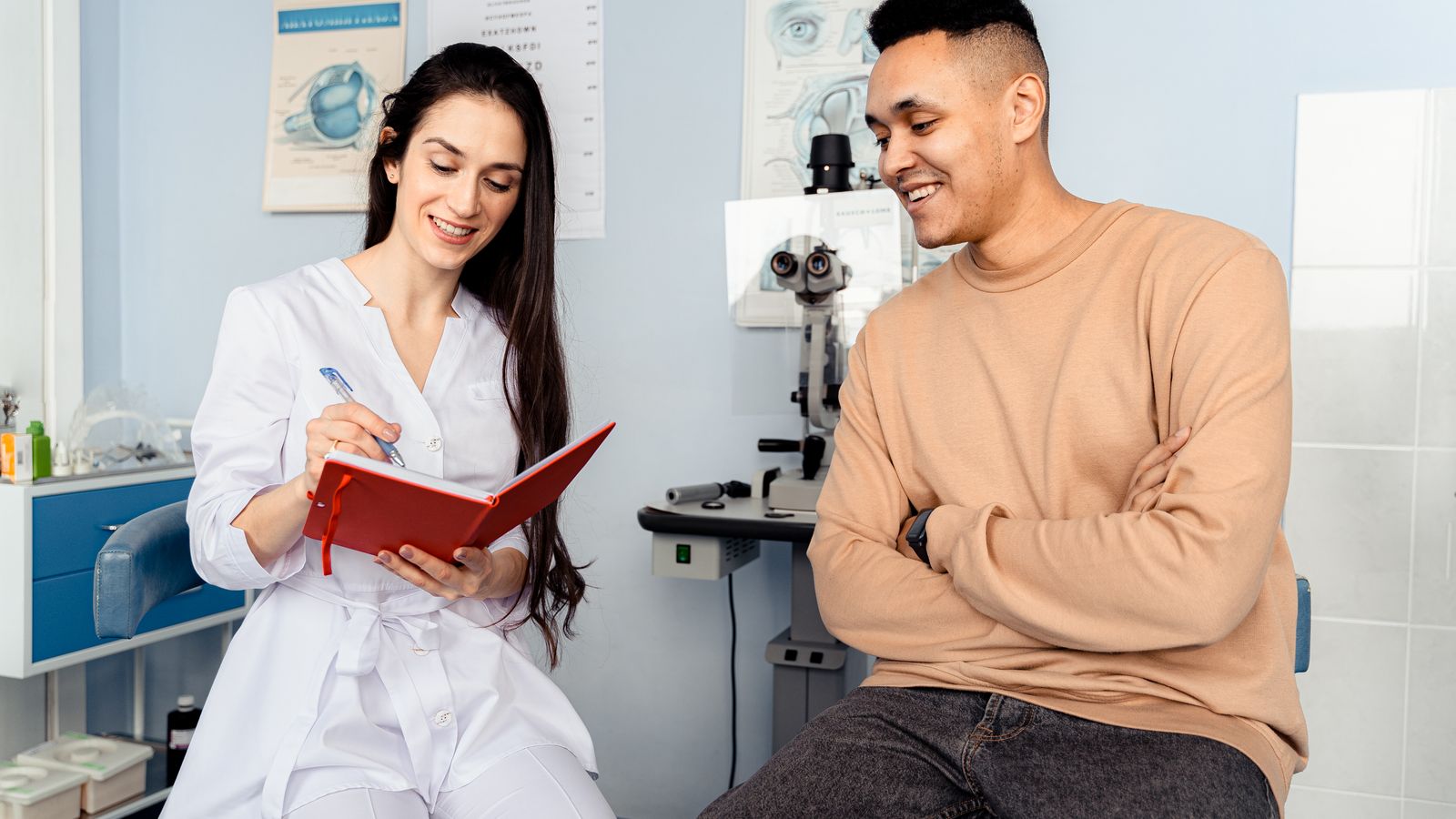 Ophthalmologist talking with a patient during a clinic consultation