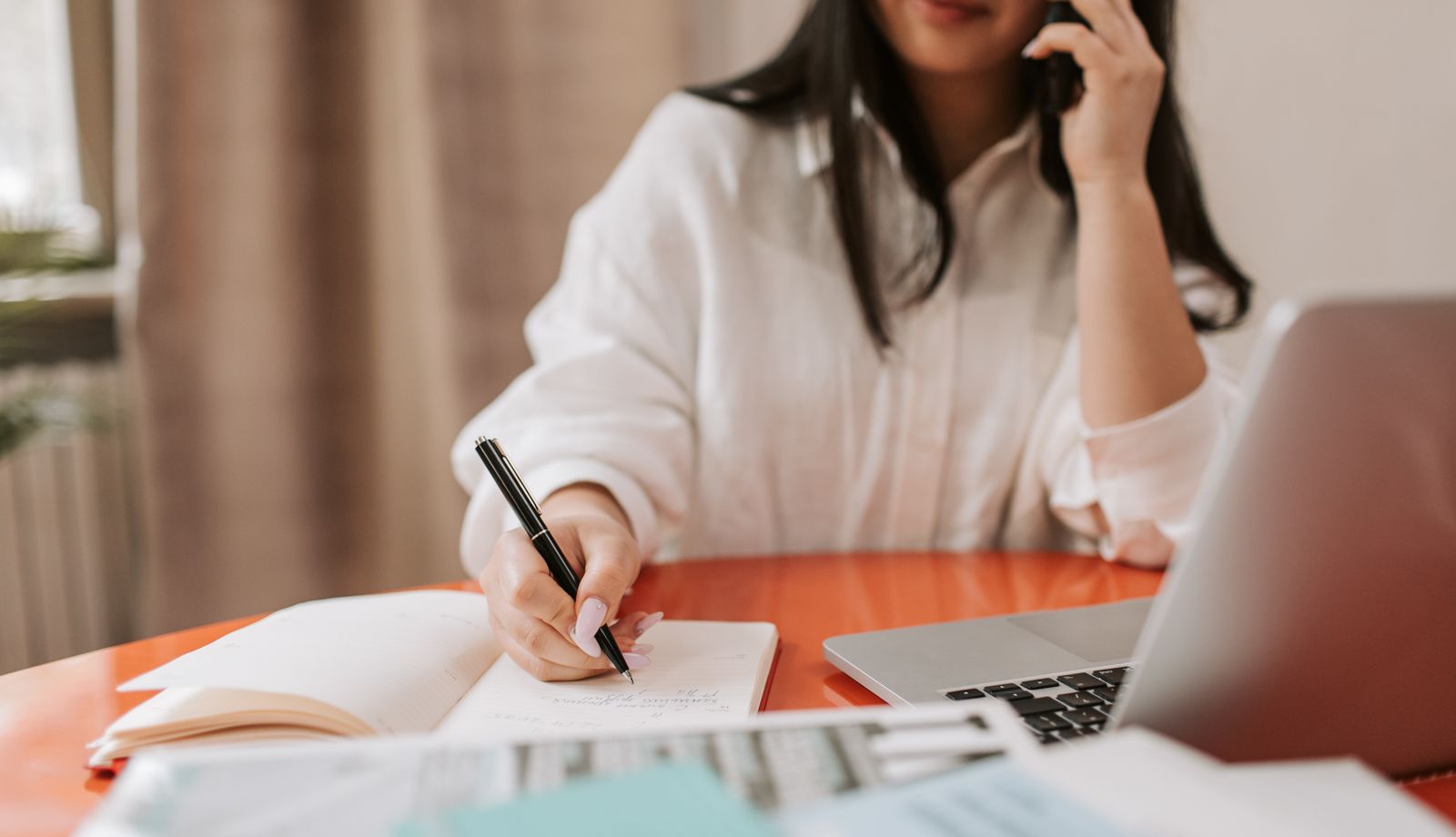 Coordinator taking notes during an outbound patient recall call