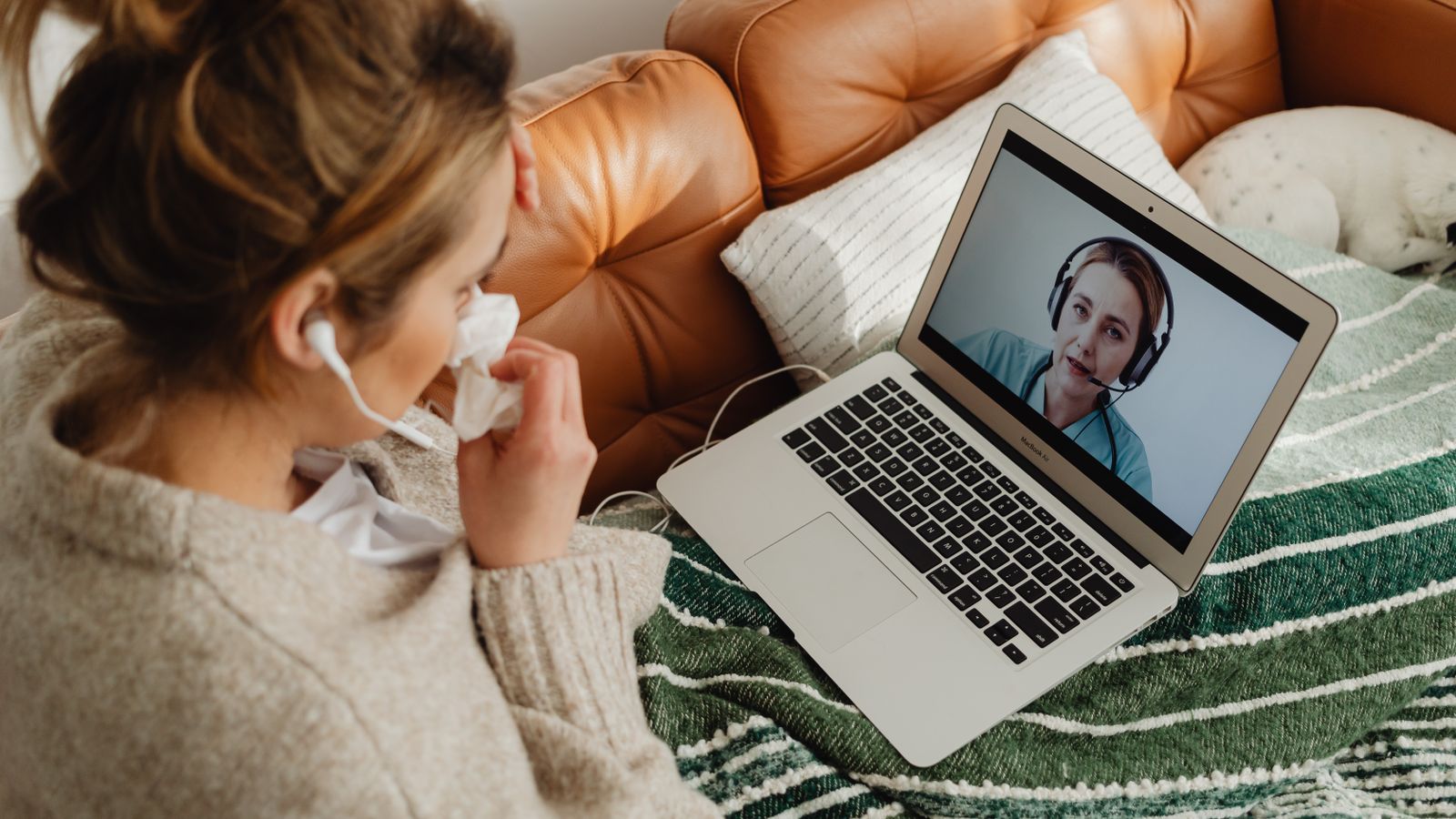 Patient having a telehealth video visit from home on a laptop