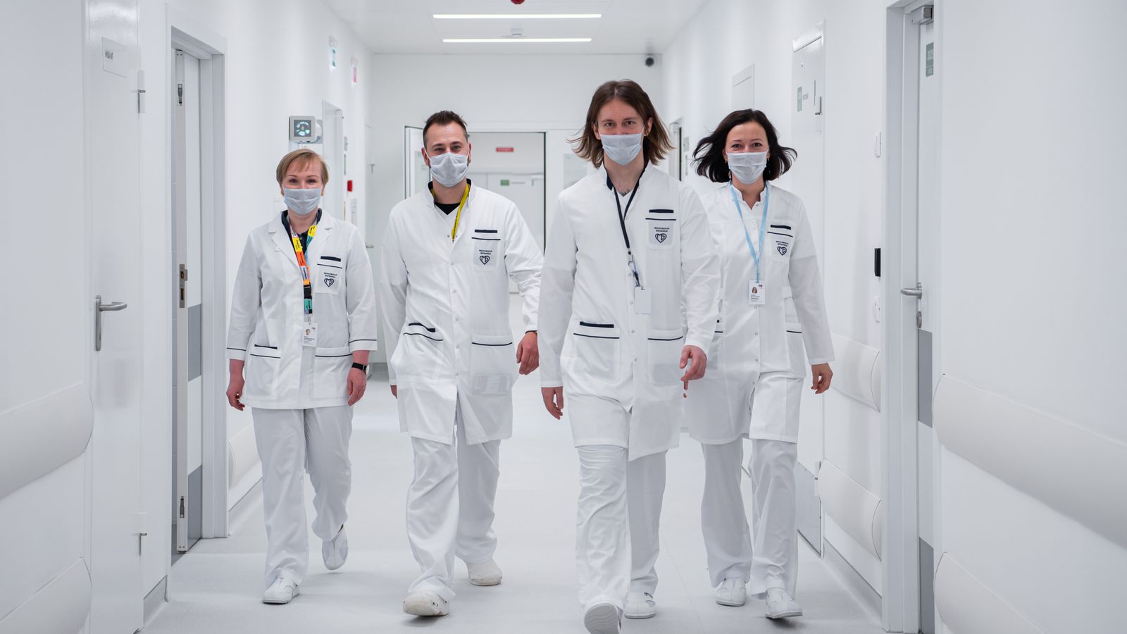 Clinical team walking together through a busy corridor