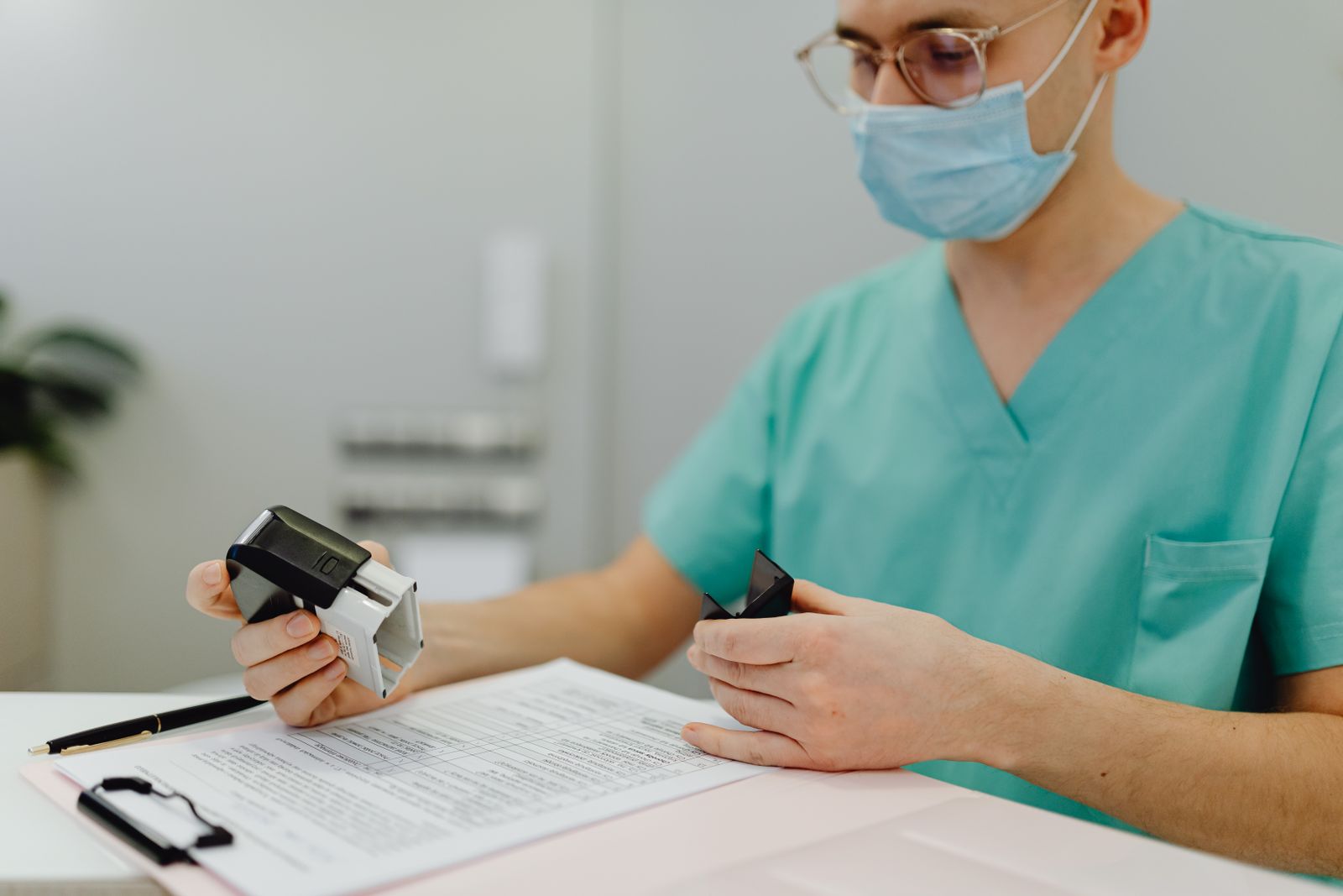 Clinic staff member reviewing quality reporting documentation