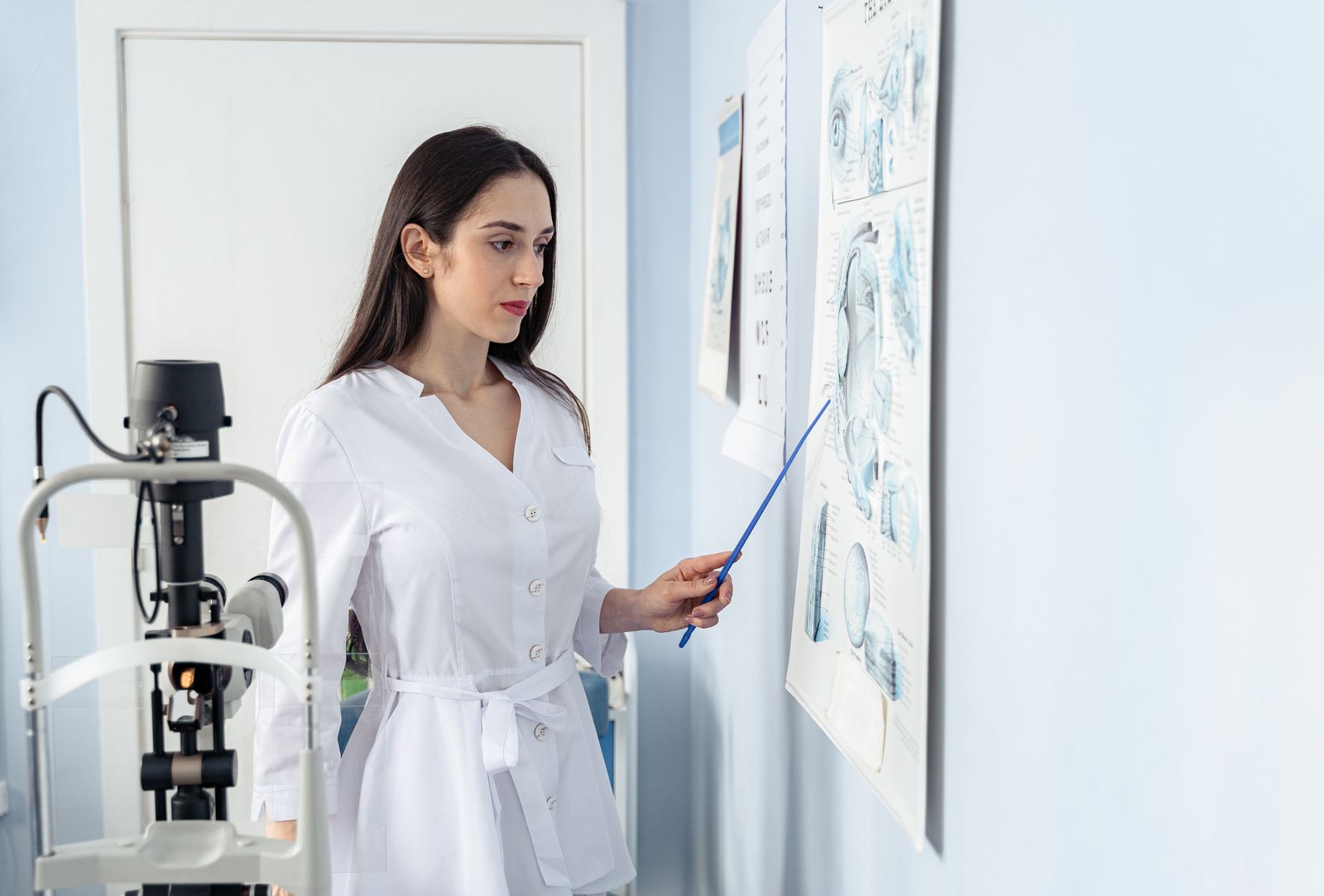 Ophthalmologist reviewing options with a patient in a clinic exam room