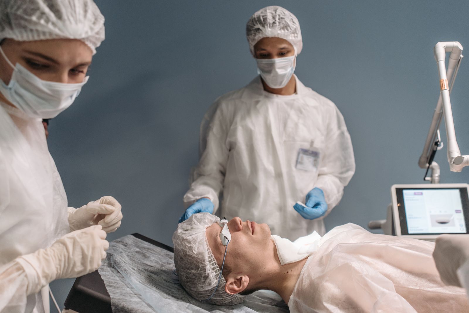 Surgical team preparing an operating room for an eye care procedure