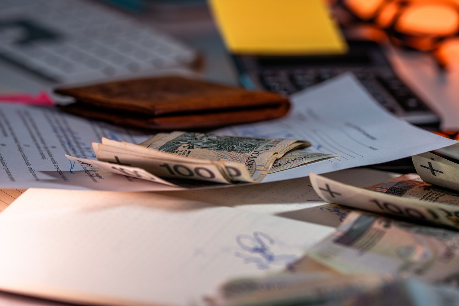 Billing paperwork and financial documents spread across an office desk
