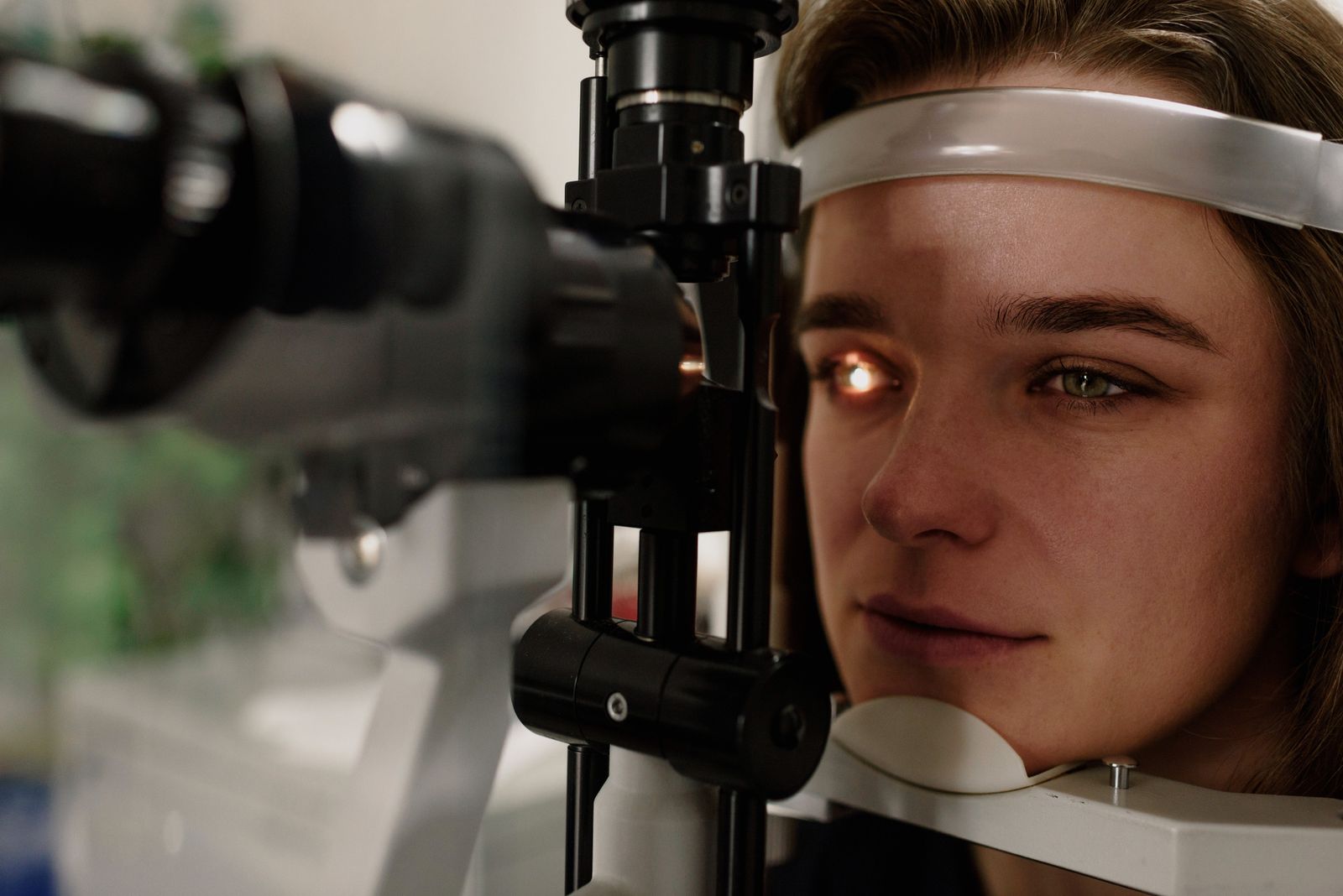 Patient at a slit lamp during a medical eye examination