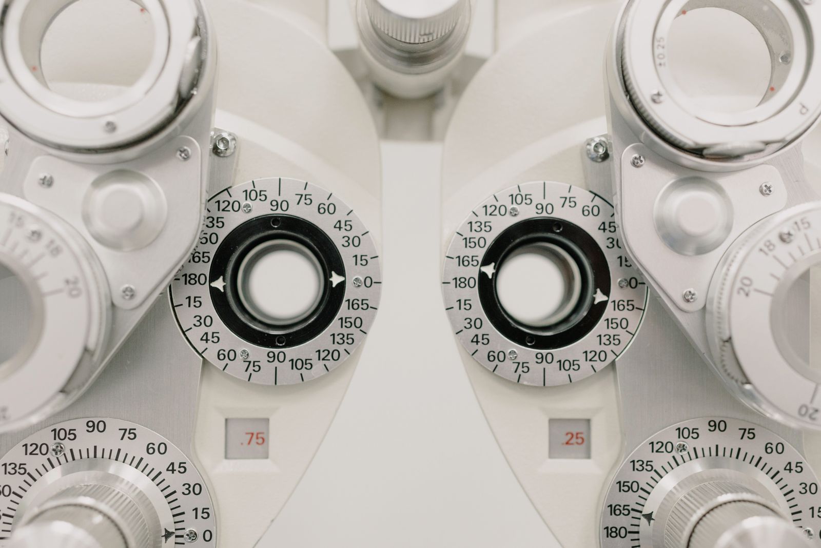 Modern phoropter and diagnostic equipment in an optometry exam lane
