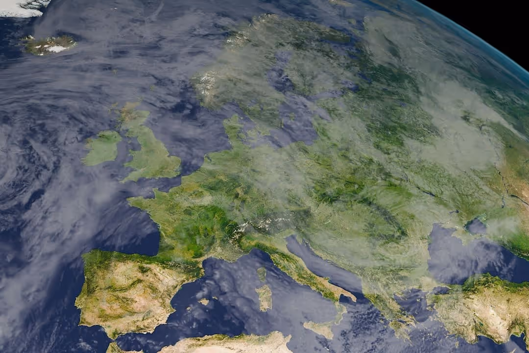 Satellite view of Europe showing the continent's landmass, surrounding seas, and partial cloud coverage.