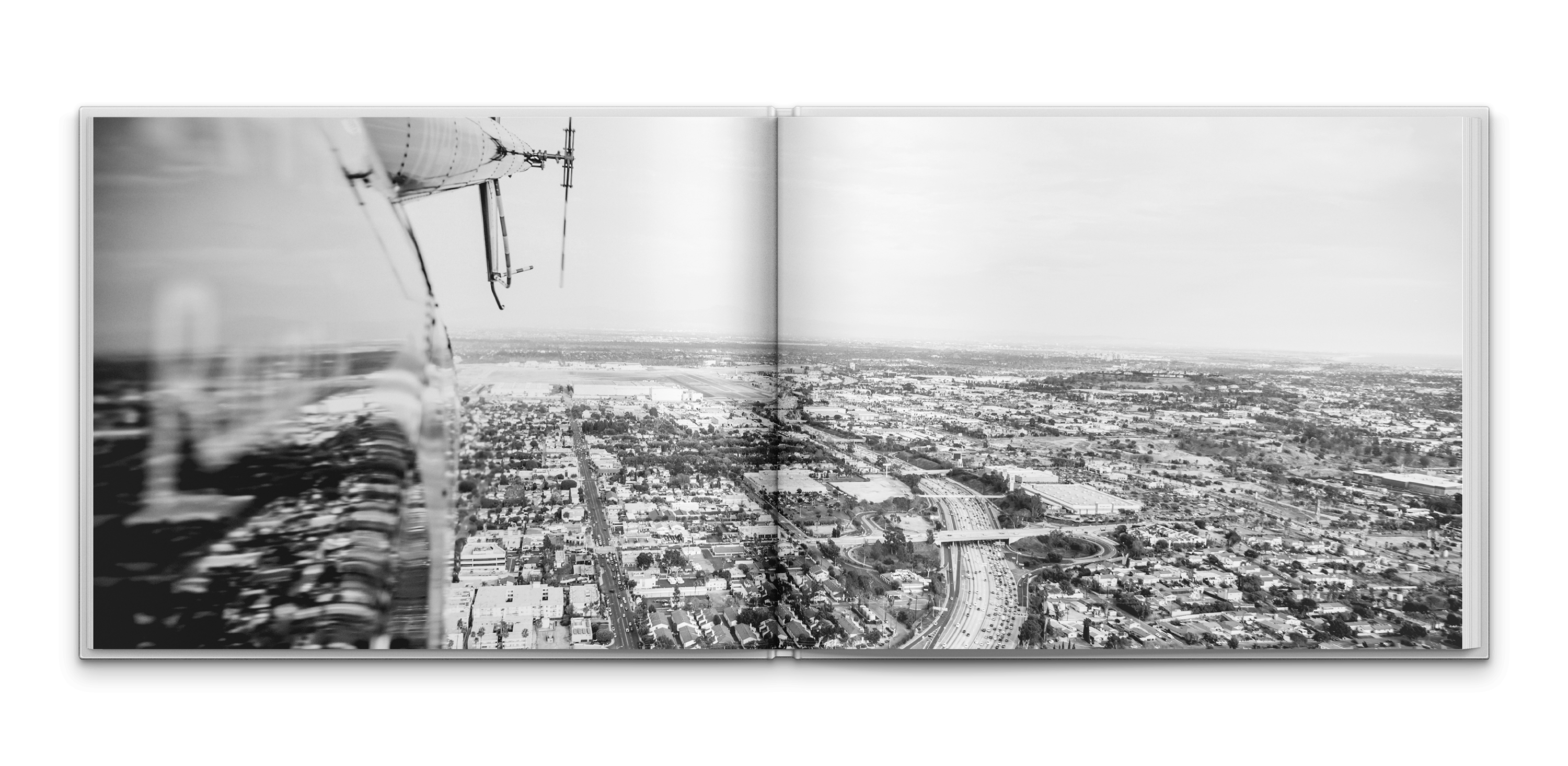 Opening spread of the Karma Automotive brand book featuring an aerial black-and-white city landscape introducing the luxury brand research and strategy narrative.
