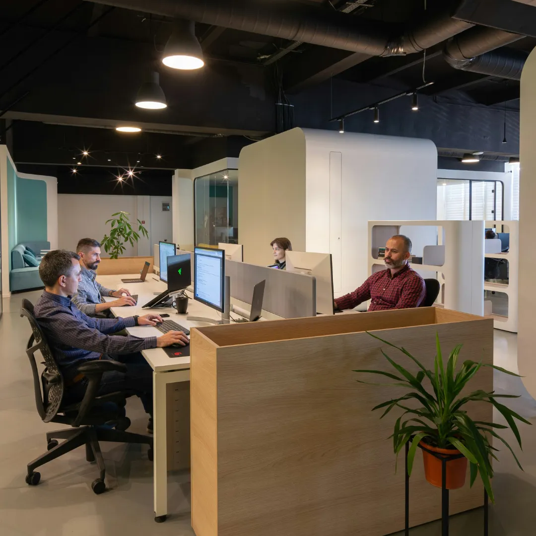 Modern office space with four accountants at desks in Jameco Construction CFO