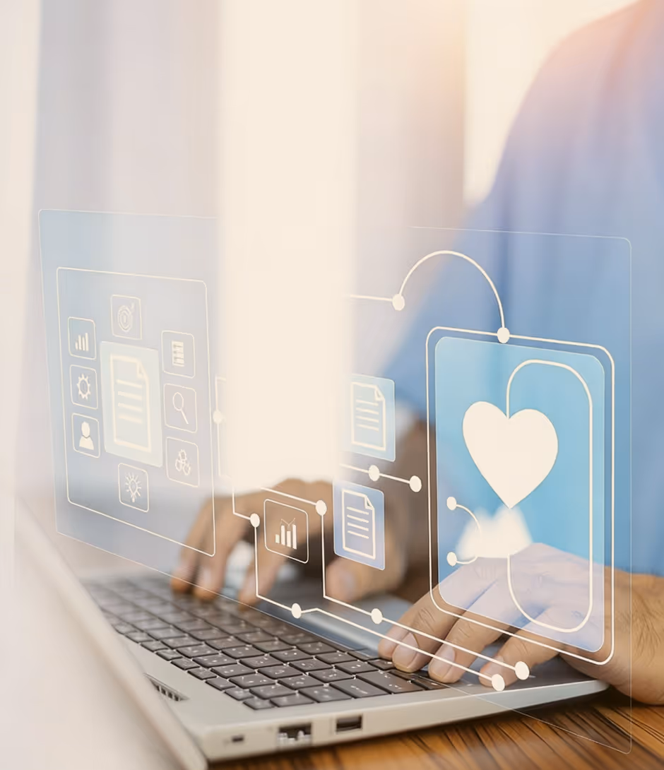 Person typing on laptop with digital health and data icons overlayed, including a heart symbol.