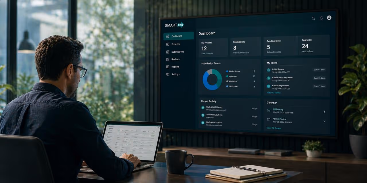 Man working on laptop with SMART IRB dashboard displayed on large screen in modern office.