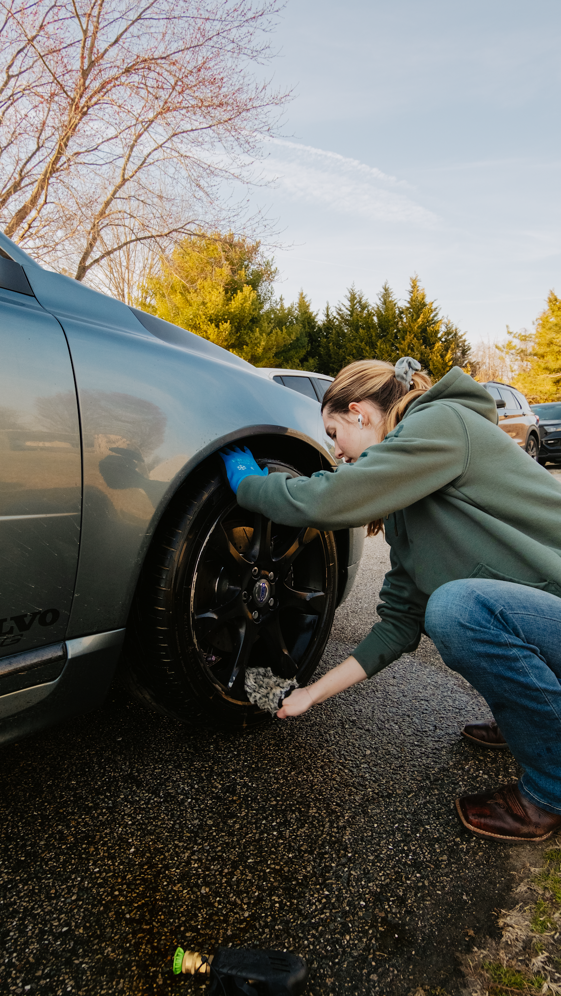 Professional wheel cleaning during auto detailing service