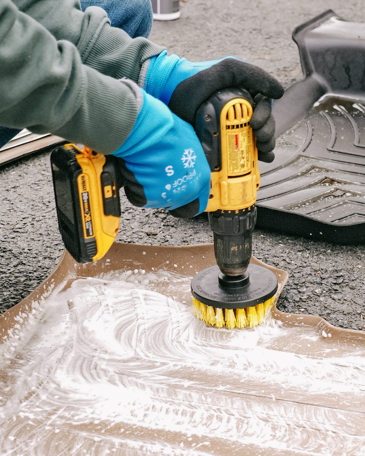 Close-up of weather mat cleaning with non-toxic detailing products