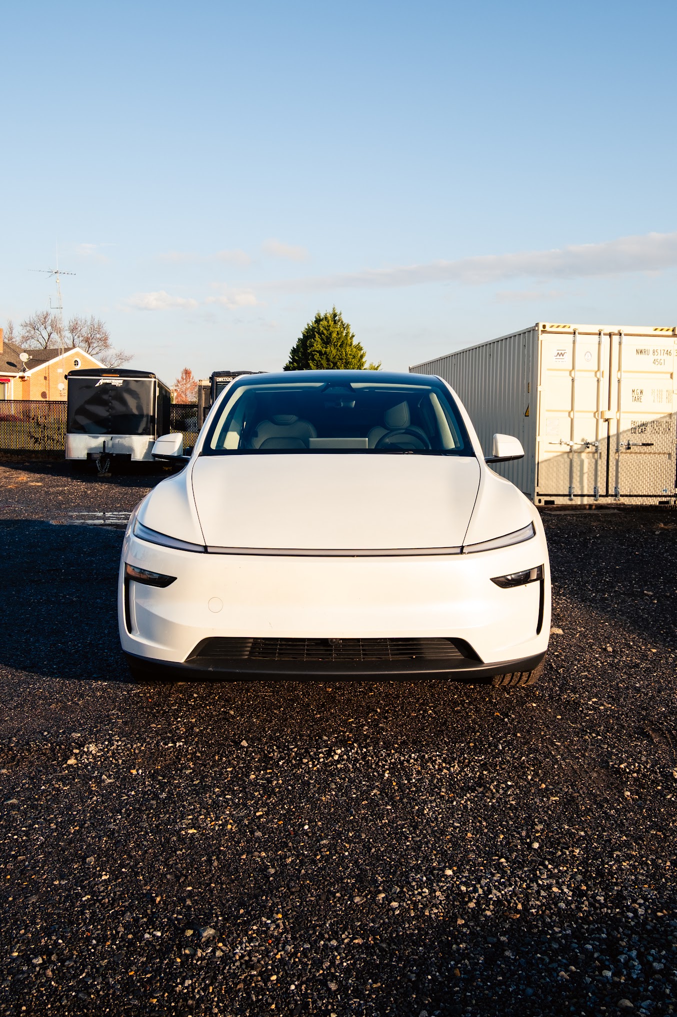 White Tesla front view showing flawless paint finish from professional correction and coating
