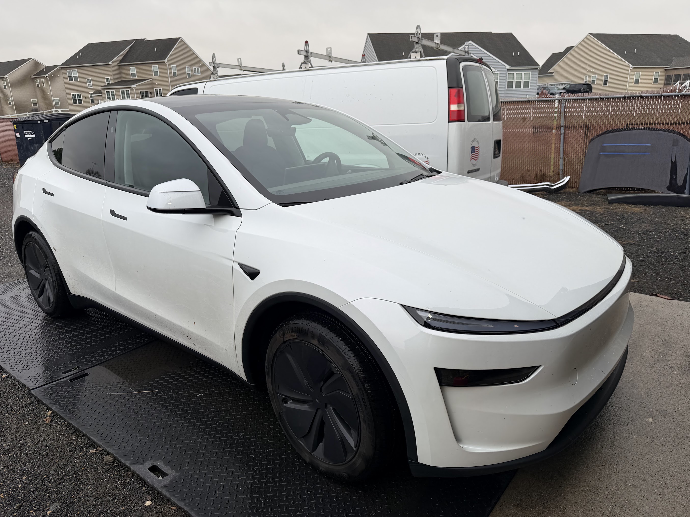 White Tesla at Dynamite Details Delaware studio ready for certified detailing service